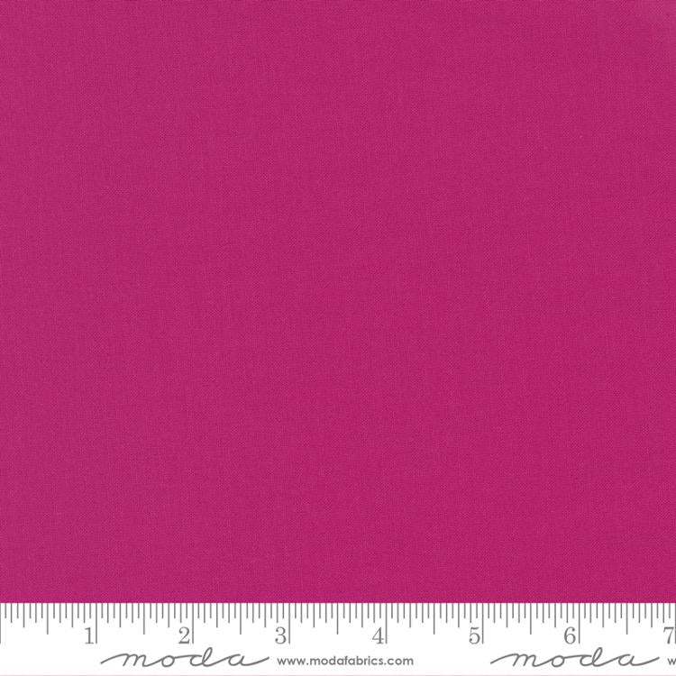 Rich berry pink quilting cotton fabric in the Berrylicious colour, featuring a smooth, even solid finish with no printed pattern or additional colours.