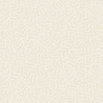 Warm cream fabric featuring an all-over pattern of delicate pale beige-grey winter branches and feathery evergreen sprigs, from Maywood Studio’s Holiday Stitches collection.