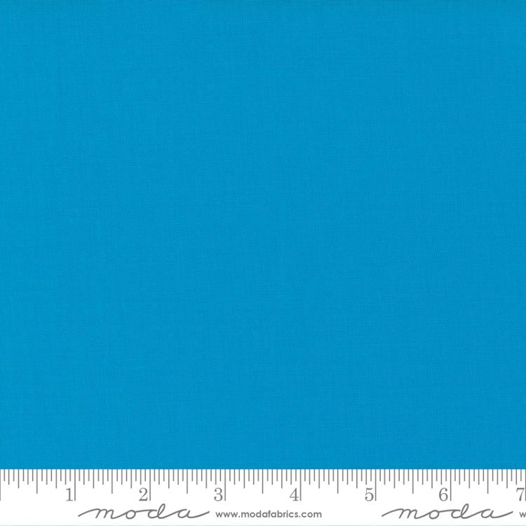 Bright turquoise blue quilting cotton fabric in the Bright Turquoise colour, featuring a smooth, even solid finish with no printed pattern or additional colours.