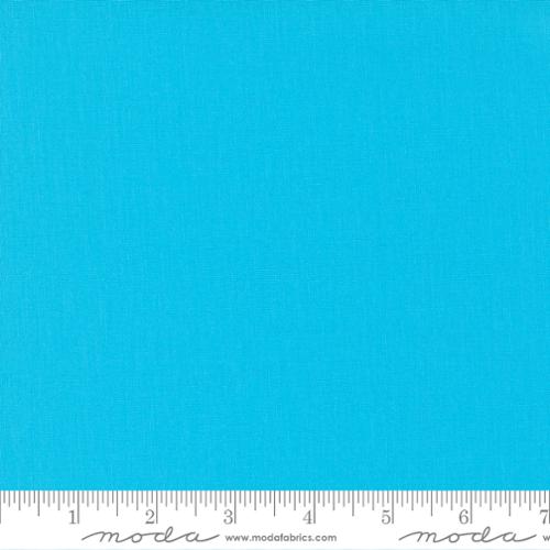 Bright turquoise blue quilting cotton fabric in the Capri colour, featuring a smooth, even solid finish with no printed pattern or additional colours.