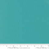 Caribbean Bella Solid from Moda Fabrics is a vibrant, tropical blue-green solid cotton with a rich, refreshing tone.
