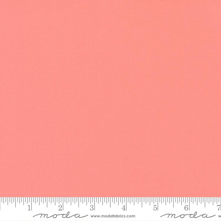 Carnation pink quilting cotton fabric featuring a smooth, even solid finish with no printed pattern or additional colours across the surface.