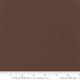 Rich chocolate brown quilting cotton fabric in the Chocolate colour, featuring a smooth, even solid finish with no printed pattern or additional colours.