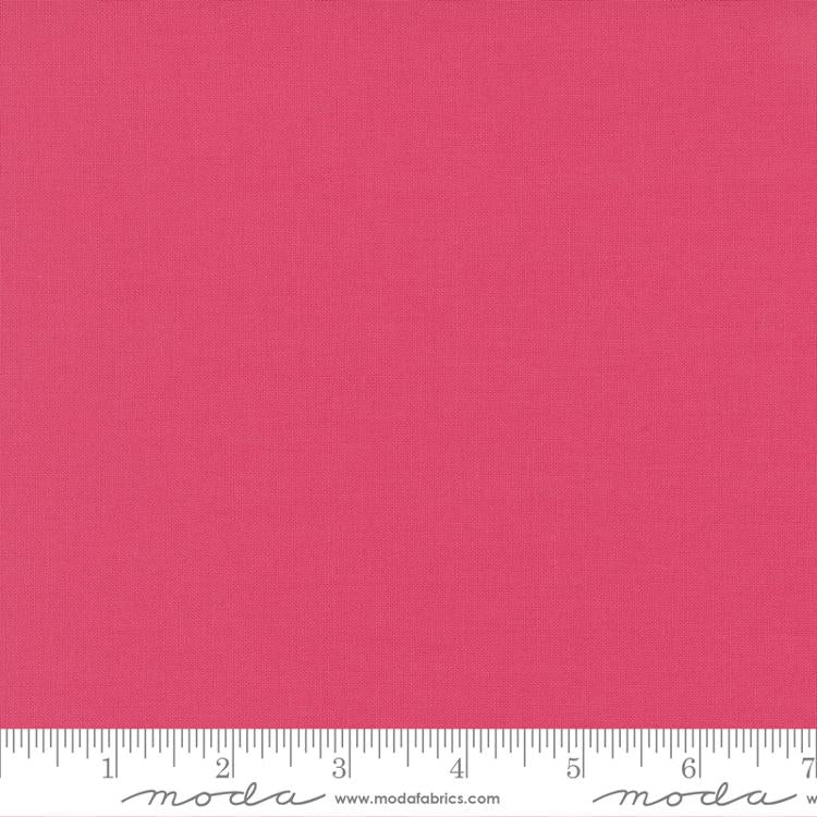 Bright pink quilting cotton fabric in the Chrysanthemum colour, featuring a smooth, even solid finish with no printed pattern or additional colours.