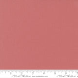 Coral Rose Bella Solid from Moda Fabrics is a warm, coral-pink solid cotton with a soft, rosy tone.