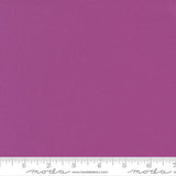 Rich purple quilting cotton fabric in the Cyclamen colour, featuring a smooth, even solid finish with no printed pattern or additional colours.