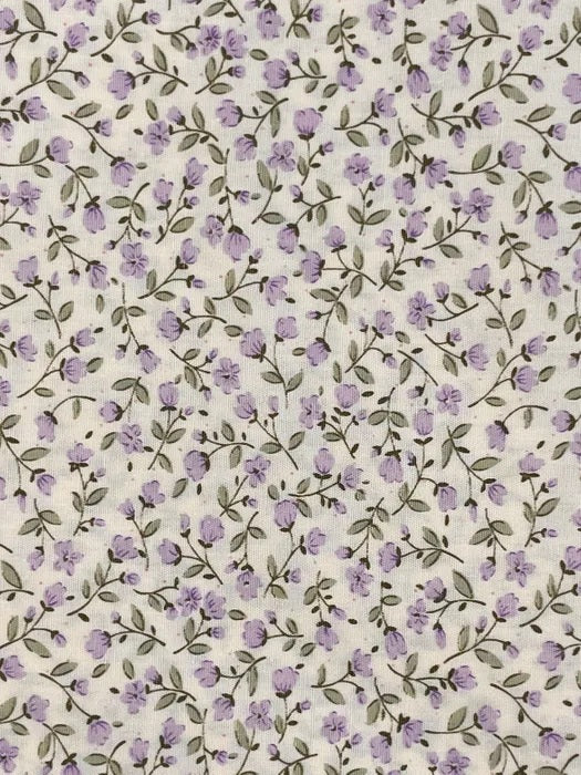 A pretty small-scale floral print from Sevenberry, featuring delicate lavender-purple blossoms scattered across a soft cream background. Fine olive-grey trailing stems and tiny leaves weave throughout the design, giving the fabric a gentle, natural flow.

With its soft colouring and dainty cottage-garden style, this print is ideal for quilting, patchwork, dressmaking accents, linings, small accessories, and sweet vintage-inspired sewing projects.