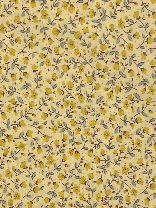 A delicate small-scale floral print from Sevenberry, featuring tiny golden yellow blossoms and buds scattered across a warm buttery yellow background. Fine brown trailing stems weave softly through the design, accented with small muted green and blue-green leaves for a gentle contrast.

This sweet, vintage-inspired print has a soft cottage-garden feel, making it ideal for quilting, patchwork, craft sewing, linings, small accessories, and cheerful handmade projects.