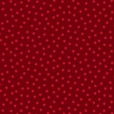 Red tonal fabric featuring a lively scattering of small crimson and deep-red dots across a rich festive red background.