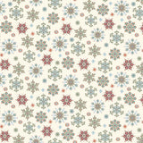 Cream Christmas fabric featuring an assortment of detailed snowflakes in festive red, blue, teal and green, scattered across a warm cream background with tiny dots resembling falling snow.