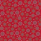 Red Christmas fabric featuring intricately detailed snowflakes in cream, pale blue, teal and red, scattered across a rich festive red background with tiny dots resembling falling snow.