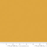 Mustard yellow quilting cotton fabric in the Dijon colour, featuring a smooth, even solid finish with no printed pattern or additional colours.