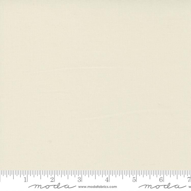 Warm eggshell cream quilting cotton fabric in the Eggshell colour, featuring a smooth, even solid finish with no printed pattern or additional colours.