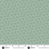 Vintage blue Christmas quilting cotton fabric featuring small blue branches with narrow leaves scattered across a pale blue background in a tonal botanical design.