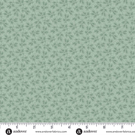 Vintage blue Christmas quilting cotton fabric featuring small blue branches with narrow leaves scattered across a pale blue background in a tonal botanical design.