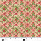 Pink and cream Christmas quilting cotton fabric featuring red and green floral motifs inside diamond shapes, bordered by holly leaves, red berries and flowers.