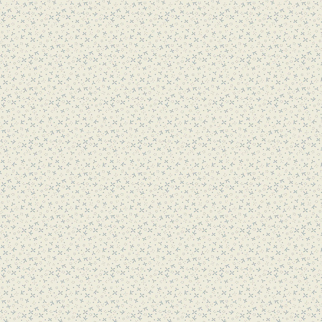 Cream quilting cotton fabric featuring small blue abstract petal and twig shapes with tiny blue dots scattered across a warm cream background.