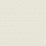 Cream quilting cotton fabric featuring small blue abstract petal and twig shapes with tiny blue dots scattered across a warm cream background.