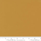 Dark golden yellow quilting cotton fabric in the Harvest Gold colour, featuring a smooth, even solid finish with no printed pattern or additional colours.
