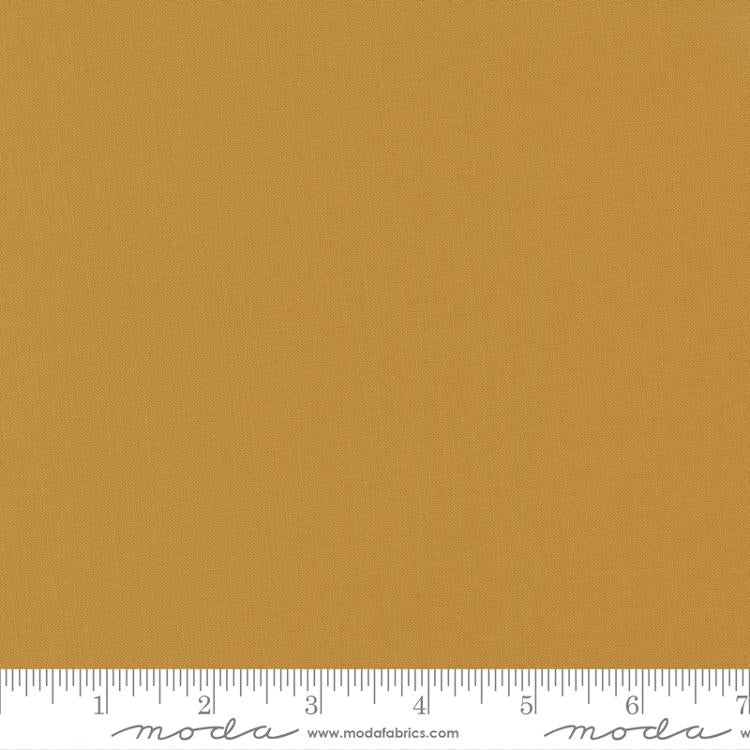 Dark golden yellow quilting cotton fabric in the Harvest Gold colour, featuring a smooth, even solid finish with no printed pattern or additional colours.