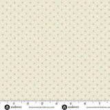 Small beige mini dots on a warm cream linen-coloured background, shown with the Andover Fabrics selvage ruler. Laundry Basket Quilts. Frontier Fabrics.