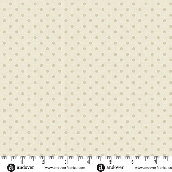 Small beige mini dots on a warm cream linen-coloured background, shown with the Andover Fabrics selvage ruler. Laundry Basket Quilts. Frontier Fabrics.