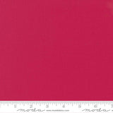 Deep pinkish-red quilting cotton fabric in the Lipstick colour, featuring a smooth, even solid finish with no printed pattern or additional colours.