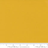 Warm mustard yellow quilting cotton fabric in the Mustard colour, featuring a smooth, even solid finish with no printed pattern or additional colours.