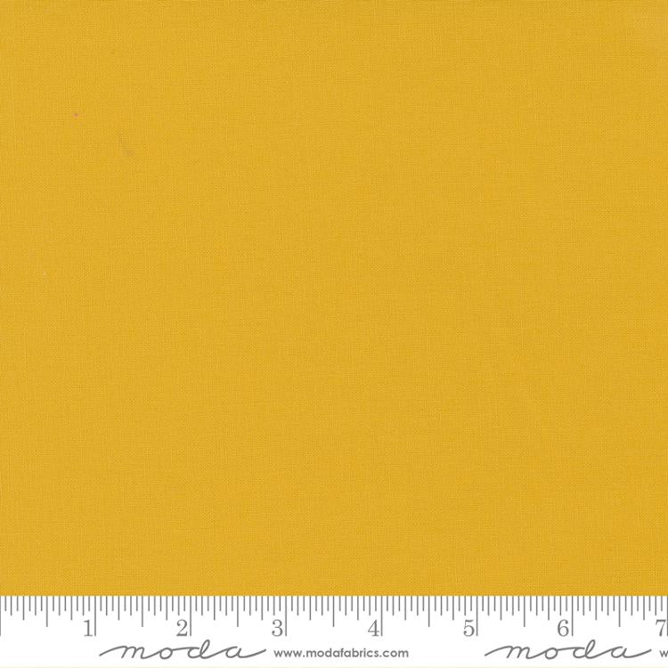 Warm mustard yellow quilting cotton fabric in the Mustard colour, featuring a smooth, even solid finish with no printed pattern or additional colours.