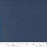 Rich deep blue quilting cotton fabric in the Nautical Blue colour, featuring a smooth, even solid finish with no printed pattern or additional colours.