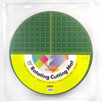 15-inch rotating cutting mat with grid pattern on a white background