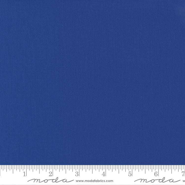Rich sapphire blue quilting cotton fabric in the Sapphire colour, featuring a smooth, even solid finish with no printed pattern or additional colours.