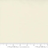 Creamy off-white quilting cotton fabric in the Silky Snow colour, featuring a smooth solid finish with a subtle sheen and no printed pattern.
