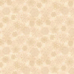 Cream Christmas fabric featuring an assortment of intricately detailed snowflakes in soft ivory, beige and pale gold tones, scattered across a warm mottled cream background with tiny white dots resembling falling snow.