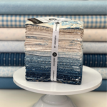 Special Delivery by Laundry Basket Quilts for Andover featuring 33 fat quarters in blues & neutrals.