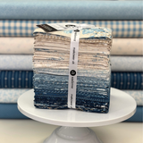 Special Delivery by Laundry Basket Quilts for Andover featuring 33 fat quarters in blues & neutrals.