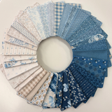 Special Delivery by Laundry Basket Quilts for Andover featuring 33 fat quarters in blues & neutrals. - Frontier Fabrics
