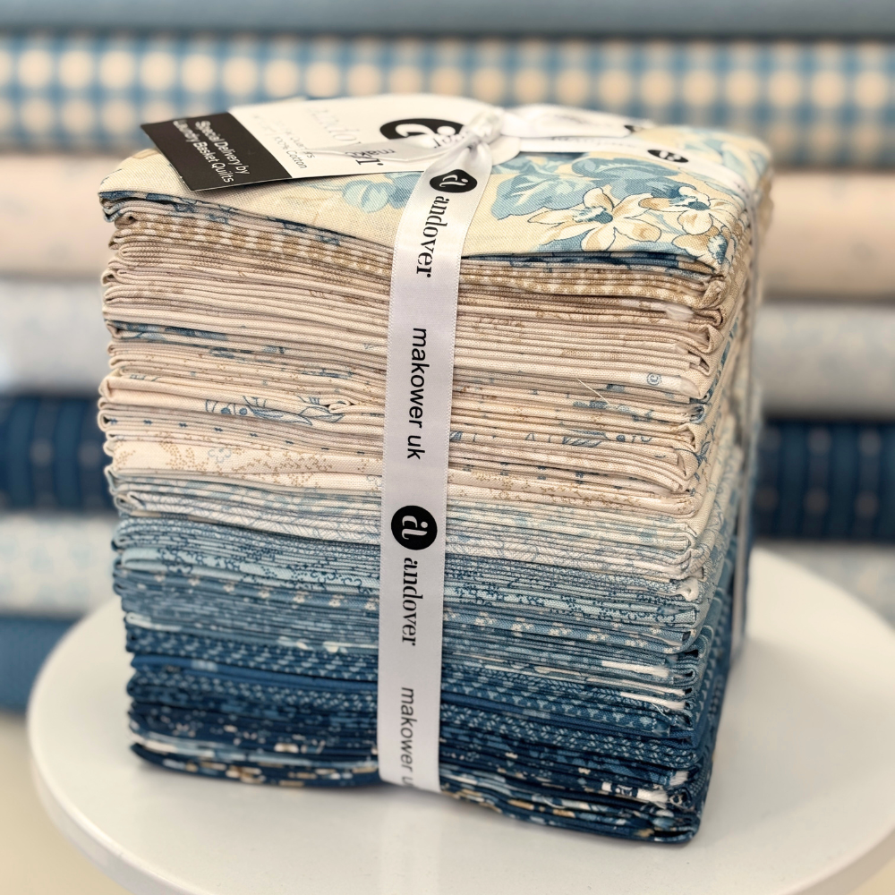 Special Delivery by Laundry Basket Quilts for Andover featuring 33 fat quarters in blues & neutrals.