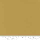 Golden straw yellow quilting cotton fabric in the Straw colour, featuring a smooth, even solid finish with no printed pattern or additional colours.