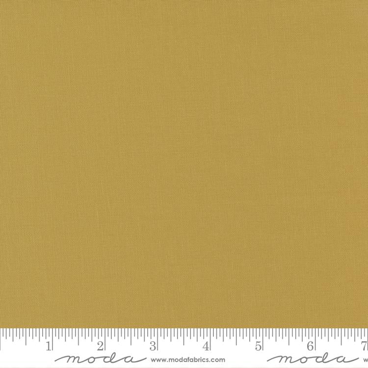 Golden straw yellow quilting cotton fabric in the Straw colour, featuring a smooth, even solid finish with no printed pattern or additional colours.