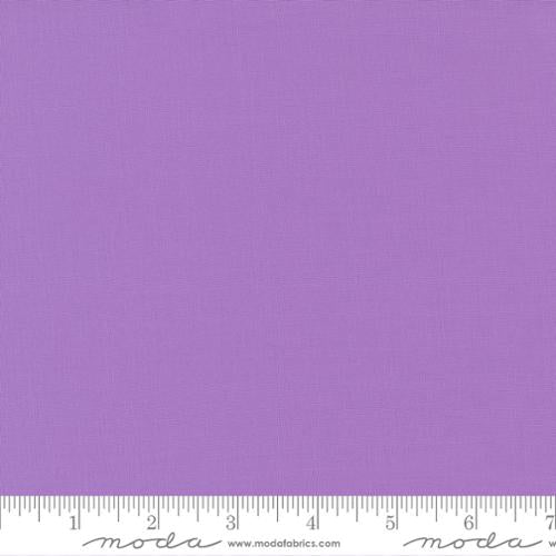 Soft plum purple quilting cotton fabric in the Sugar Plum colour, featuring a smooth, even solid finish with no printed pattern or additional colours.
