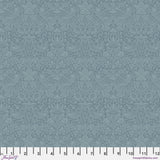 Blue quilting cotton fabric featuring pairs of light blue birds among strawberries, flowers and curling leaves across a muted blue background in a tonal design.