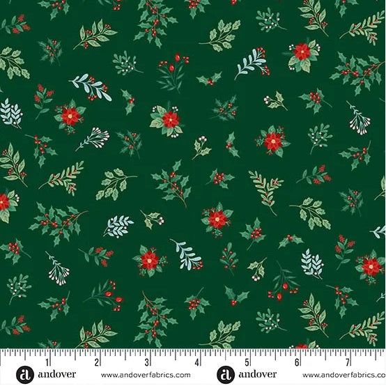 A festive Christmas cotton print featuring scattered holly sprigs, berries, leafy stems, and small poinsettia-style flowers on a deep forest green background. M226G